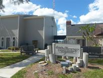Windjammer community clubhouse with sign, exterior view on a sunny day at 1400 Gandy N Blvd # 708, St Petersburg, FL 33702