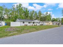 Charming single-story home with a well-maintained front yard and fresh exterior paint at 16411 Lake Byrd Dr, Tampa, FL 33618