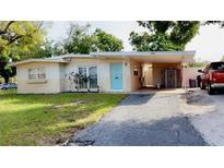 Charming single story house with a covered carport and a well-maintained front yard at 5443 Tangerine Dr, New Port Richey, FL 34652