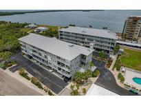 A beautiful waterfront condo complex with stunning water views and lush landscaping at 7 Island Park Pl # 204, Dunedin, FL 34698