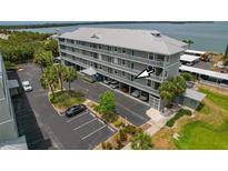 Beautiful waterfront condo complex with well-maintained grounds and covered parking at 7 Island Park Pl # 204, Dunedin, FL 34698