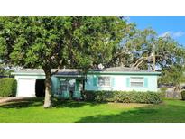 Charming single-story home with a well-manicured lawn and lush landscaping at 7336 20Th N St, St Petersburg, FL 33702