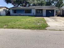 Modest single-story home with a small front yard and attached one-car garage at 5700 65Th N Ave, Pinellas Park, FL 33781