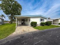 Charming single-story home with a covered carport and well-maintained landscaping at 5150 Damsen Cir, New Port Richey, FL 34653