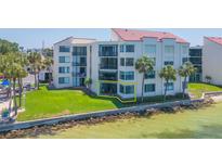 Beautiful beachfront condo featuring a well-maintained lawn and a private balcony with water views at 5729 Puerta Del Sol S Blvd # 185, St Petersburg, FL 33715