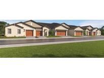 New construction townhomes with garages, sidewalks, and well-manicured lawn at 10853 Rustic Eve Ct, Land O Lakes, FL 34638