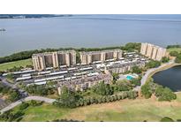 Beautiful aerial view of condo community featuring lush greenery and waterfront views at 2615 Cove Cay Dr # 409, Clearwater, FL 33760