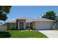 Charming single-story home with well-maintained lawn and neutral exterior paint at 404 Oakmount Rd, Clearwater, FL 33765