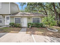 Charming condo featuring a well-maintained exterior with lush landscaping and a welcoming entrance at 602 Lynchburg Dr, Brandon, FL 33511