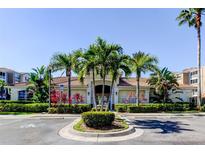 Community clubhouse featuring tropical landscaping, covered entrance, and convenient parking at 7901 Seminole Blvd # 1103, Seminole, FL 33772