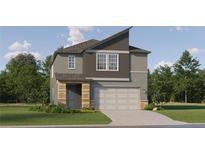 Charming two-story home featuring a modern design, a two-car garage, and a beautifully landscaped front yard at 11546 E 71St Ter, Palmetto, FL 34221