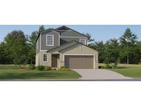 Charming two-story home with attached garage, landscaped yard, and neutral color palette at 8506 Sea Ray Run, Parrish, FL 34219