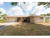 Charming single-story home with a well-maintained front yard and covered entryway at 11029 90Th Ave, Seminole, FL 33772