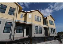 New construction townhome featuring a two-story design with modern architectural details at 1643 Springwell Ln, Sarasota, FL 34240