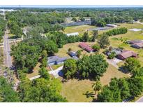 Sprawling property featuring a charming home, lush landscaping, and ample space at 101 N Taylor Rd, Seffner, FL 33584