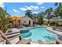 Sparkling pool and spa surrounded by lush tropical landscaping, with plenty of room for relaxing at 146 8Th Ne Ave, St Petersburg, FL 33701