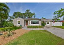 Charming single-story home featuring a well-manicured lawn and inviting front entrance at 716 75Th N St, St Petersburg, FL 33710