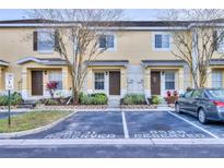 Charming townhouse exterior featuring reserved parking and well-maintained landscaping at 8531 Trail Wind Dr, Tampa, FL 33647