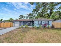 Charming single-story home with a cozy front porch and a well-maintained lawn at 15591 Darien Way, Clearwater, FL 33764