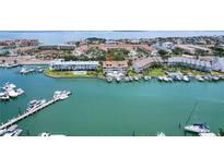 Waterfront condo with boat docks and pool offers stunning coastal living at 350 Pinellas Bayway S # 7, Tierra Verde, FL 33715