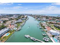 Aerial view of canal homes with boat docks and waterfront access at 350 Pinellas Bayway S # 7, Tierra Verde, FL 33715