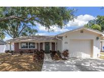 Charming single-story home with a brick facade, lush landscaping, and a welcoming front entrance, perfect for suburban living at 3537 12Th N Ave, St Petersburg, FL 33713