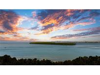 Panoramic water view at sunset showcases the beauty of the surrounding nature at 7200 Sunshine Skyway S Ln # 4B, St Petersburg, FL 33711