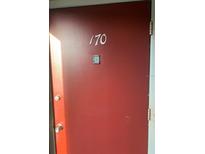 Image of the red front door with the unit number 170 displayed on the surface at 1799 N Highland Ave # 170, Clearwater, FL 33755