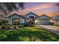 Charming single-Gathering home with a well-manicured lawn and a two-car garage at 3023 Bent Creek Dr, Valrico, FL 33596