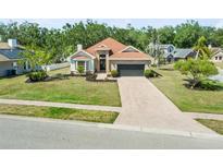 Charming single-story home with brick accents, manicured lawn, and a spacious driveway at 4317 74Th E Ave, Sarasota, FL 34243