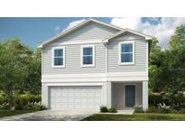 Charming two-story home with light grey siding, white trim, and a two car garage at 13279 Tropical Breeze Way, Hudson, FL 34669