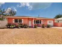 Charming single-story home with a well-manicured lawn and appealing curb appeal in a sunny neighborhood at 180 58Th Ave, St Pete Beach, FL 33706