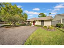 Charming single-story home with well-manicured landscaping and a spacious driveway at 20 Windrush Bay Dr # 20, Tarpon Springs, FL 34689