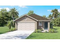 Charming single-story home featuring an attached garage and neatly landscaped yard at 36201 Sunflower Hill Dr, Zephyrhills, FL 33541