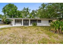 Charming single-story home featuring a double-door entry and well-maintained landscaping at 2026 Cocoanut Ave, Sarasota, FL 34234