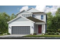 Two-story home with gray accents, gray garage door, a red front door, and manicured front lawn at 845 Steel Dr, Apollo Beach, FL 33572