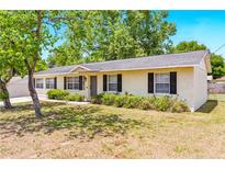 Charming single-story home with a well-maintained lawn and inviting curb appeal at 27343 Warner Ave, Brooksville, FL 34602