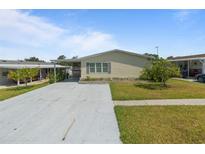 Charming single-story home with a covered carport and well-maintained landscaping in a desirable community at 37639 Newport Dr, Zephyrhills, FL 33542