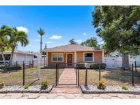 A charming fenced-in home with a well-maintained lawn and front garden at 5324 3Rd N Ave, St Petersburg, FL 33710