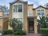Inviting two-story townhome featuring manicured landscaping and a welcoming entrance at 6405 Osprey Lake Cir, Riverview, FL 33578