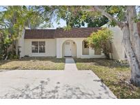 Charming single-story home featuring a welcoming entrance and mature landscaping at 9922 86Th Way, Seminole, FL 33777