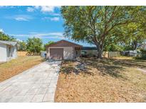 Charming single-story home with a long driveway and mature tree providing ample shade at 1159 19Th Sw Ave, Largo, FL 33778