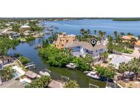 Stunning waterfront property with private boat docks and lush landscaping in a tropical setting at 1811 Bayou Grande Ne Blvd, St Petersburg, FL 33703