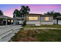 Charming single-story home featuring a carport and a cozy front yard at 3007 Aileen W St, Tampa, FL 33607