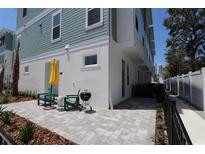 Inviting outdoor patio with chairs, grill, and stylish landscaping at 3101 4Th N Ter, St Petersburg, FL 33713