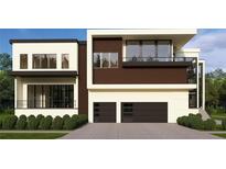 Modern two-story home boasting a sleek design with large windows, two-car garage, and minimalist landscaping at 602 & 604 Channel Dr, Tampa, FL 33606