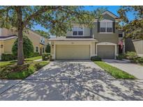 Charming two-story home featuring a well-maintained lawn and a convenient two-car garage at 4815 Barnstead Dr, Riverview, FL 33578