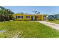 Charming yellow single-story home with blue shutters and a well-maintained front yard at 6750 Hibiscus S Ave, South Pasadena, FL 33707
