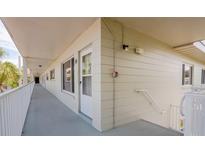 Exterior hallway with unit doors and stairs in a condo community at 2071 Australia W Way # 59, Clearwater, FL 33763