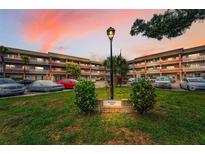 Charming condo complex with lush landscaping and ample parking at 2460 Persian Dr # 54, Clearwater, FL 33763